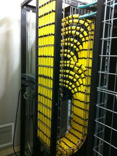 Yellow cable bundle routed in a smooth vertical loop